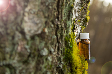Essential oil in a small brown bottle.