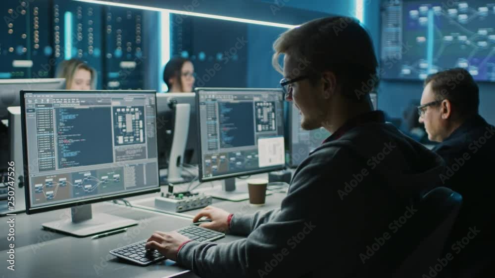 Fototapete Team of IT Programers Working on Desktop Computers in Data Center Control Room. Young Professionals Writing on Sophisticated Programming Code Language