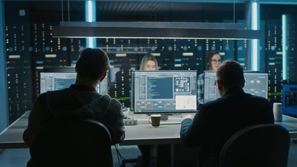 Team of IT Programers Working on Desktop Computers in Data Center Control Room. Young Professionals Writing on Sophisticated Programming Code Language - Powered by Adobe
