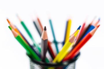 Fototapeta premium Colored pencils in a pencil case on white background