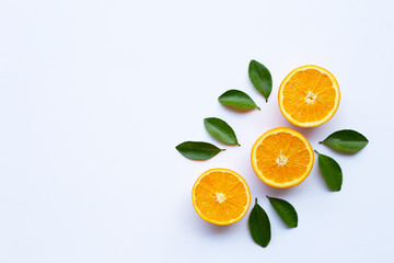 High vitamin C. Fresh orange citrus fruit with leaves isolated on white.