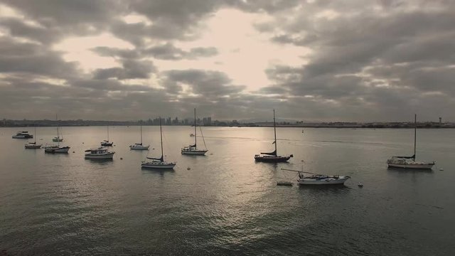 Aerial 4K view of sailboats backed by San Diego from Coronado Island.   #2