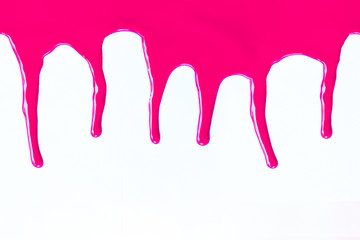 Pink paint dripping on a white.