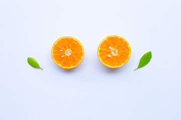 High vitamin C. Fresh orange citrus fruit with leaves isolated on white.