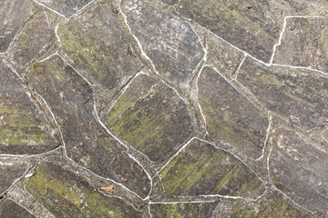 pattern of old irregular stones gives a harmonic background