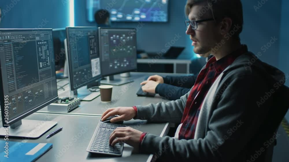 Fototapete Team of IT Programers Working on Desktop Computers in Data Center Control Room. Team of Young Professionals Working In Software and Hardware Development, Doing Coding 