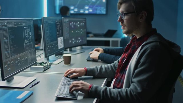 Team of IT Programers Working on Desktop Computers in Data Center Control Room. Team of Young Professionals Working In Software and Hardware Development, Doing Coding 