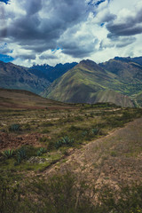 landscape in the mountains under clouds in sacred valley peru