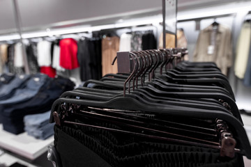 Women clothes in fashion store. Shopping mall. Women fashion shopping concept.