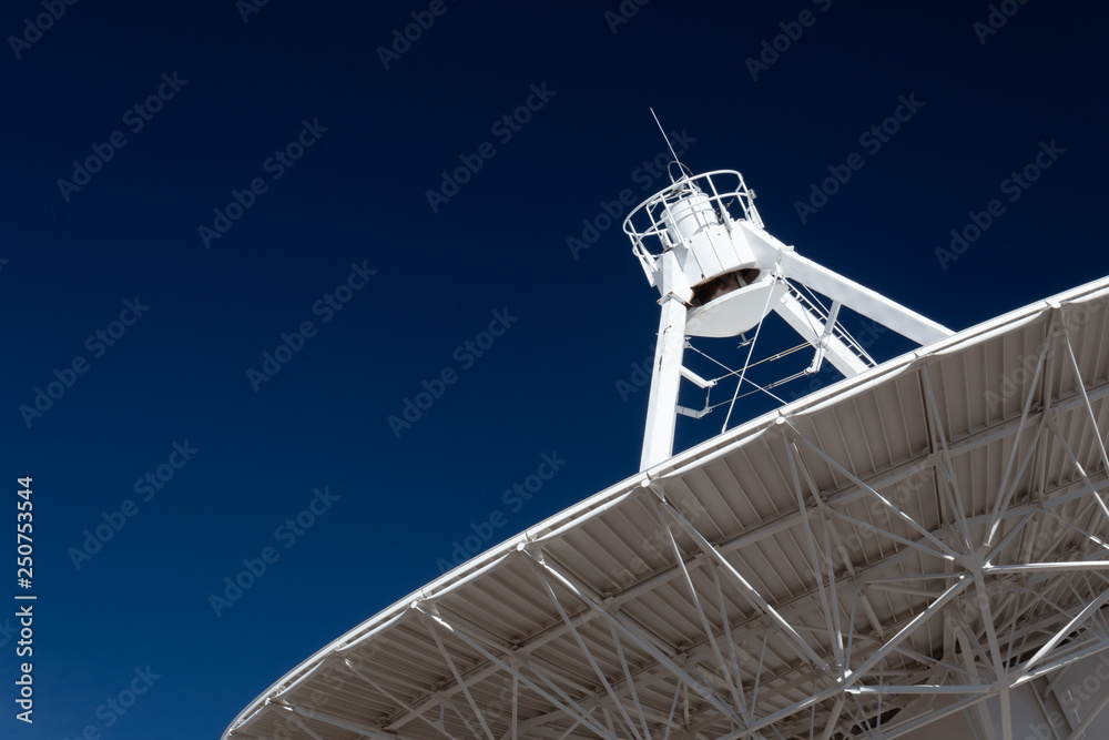Canvas Prints very large array radio telescope pointing into space, white dish against a deep blue sky, space tech