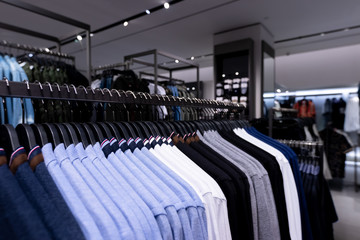 Fototapeta premium Men casual clothing shop. Men shop, men clothes in the shopping mall.