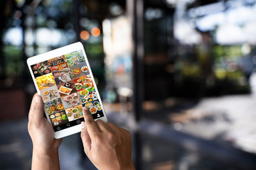 man looking phone publicly shared photo on social network