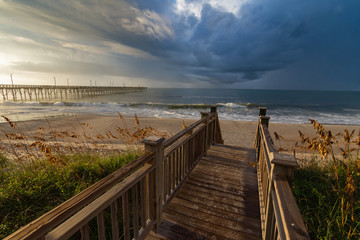 Fototapeta premium Beach boardwalk and ocean scene with magical light