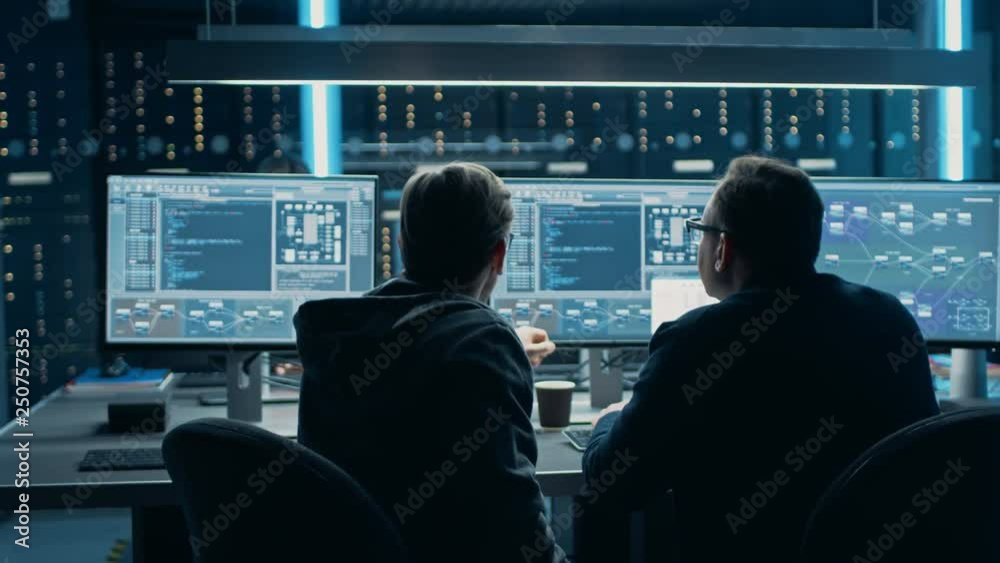 Fototapete Two Professional IT Programers Discussing Blockchain Data Network Architecture Design and Development Shown on Desktop Computer Display. Working Data Center Technical Department with Server Racks 