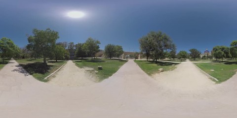 VALENCIA, SPAIN - JULY 15 2016: 360 VR video. Many paths among the green trees and lawns in the Turia Gardens, one of the largest urban parks in Spain, running through the city along nine kilometres