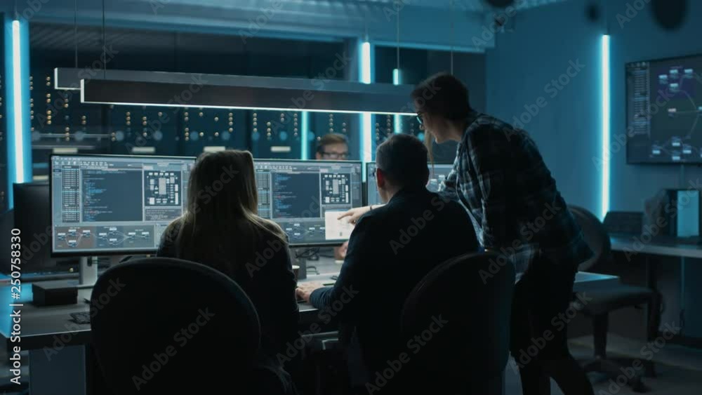 Poster Team of IT Programers Finding Solution to Blockchain Data Network Architecture Design and Development Shown on Desktop Computer Display. Working Data Center Technical Department with Server Racks 