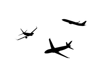 An airplane silhouette cropped on a neutral background