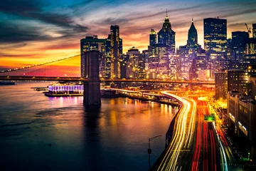 Wall murals Manhattan Must see when visiting New York City. View of Lower Manhattan and  Brooklyn at sunset. Night scene. Light trails. City lights. Urban living, travel, real estate  and transportation concept