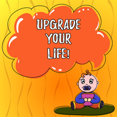 Text sign showing Upgrade Your Life. Conceptual photo improve your way of living Getting wealthier and happier Baby Sitting on Rug with Pacifier Book and Blank Color Cloud Speech Bubble