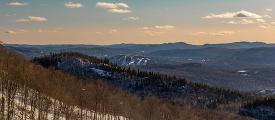 Wide shot of hills and mountains from atop Mont-Tremblant in Winter