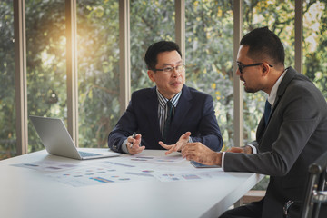 Two businessmen are meeting and planning work. Teamwork concept