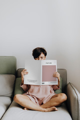 Woman reading a design magazine