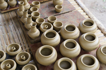 Closeup of fresh earthenware, pottery drying indoor. The classical and unique handmade product of Thailand. 