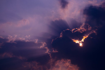 The sky has a cloud covering the sun's rays as a beautiful lobes.