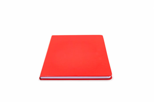 Red leather notebook isolated on white background.