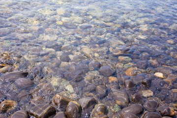 Beautiful rock pattern on beach with clear sea water in Lipe island, Satun province, Thailand