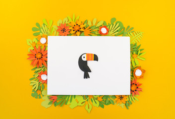 Tropical leaves and flowers made of paper. White sheet of paper. Copy space. © Дарья Колпакова