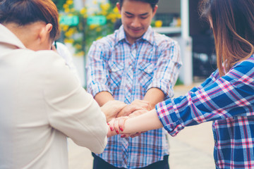 Group of business people crossed arms in pile for win. Stack of hands. Cooperation concept