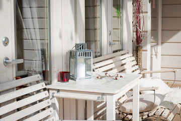 Terrace lounge with comfortable divans in a luxury house. garden furniture at the patio. Architecture modern design, veranda of modern house.Photo of relaxing area outside of mansion