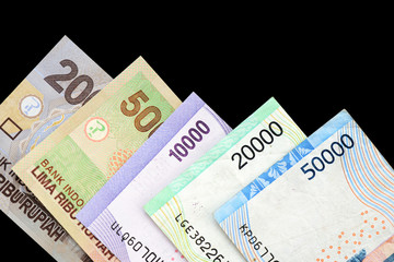Indonesian rupiah on dark background close up