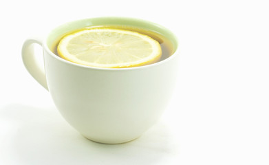 Lemon tea in a hot white glass on white background,Food Concept..