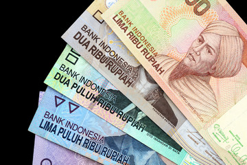Indonesian rupiah on dark background close up