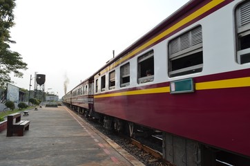 Fototapeta na wymiar Transportation : Trains in Thailand, Translation text on the sign : The name of district in Thailand, called : Sungnoen, mean : Hight Hills.