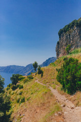 Fototapeta na wymiar Hiking trail on mountain and coastline of Amalfi Coast from Path of the Gods, near Positano, Italy