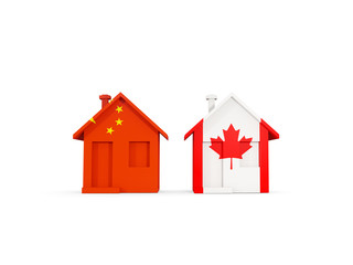 Two houses with flags of China and canada