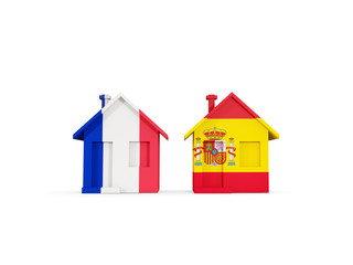Two houses with flags of France and spain