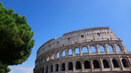 Fototapeta premium Colosseum or Flavian Amphitheatre with blue sky 
