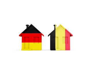 Two houses with flags of Germany and belgium