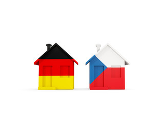 Two houses with flags of Germany and czech republic