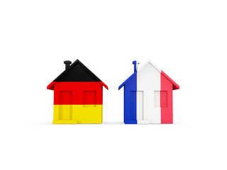 Two houses with flags of Germany and france