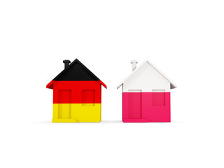 Two houses with flags of Germany and poland