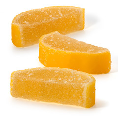 Three jelly lemon slices on a white background
