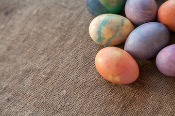 Group of Easter painted eggs on burlap