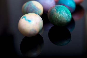 Group of easter painted eggs on black background