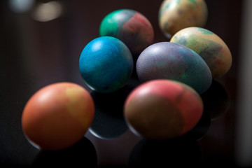 Group of easter painted eggs on black background