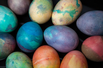 Group of easter painted eggs on black background